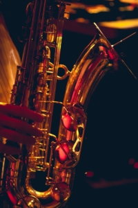 brass saxophone in black background